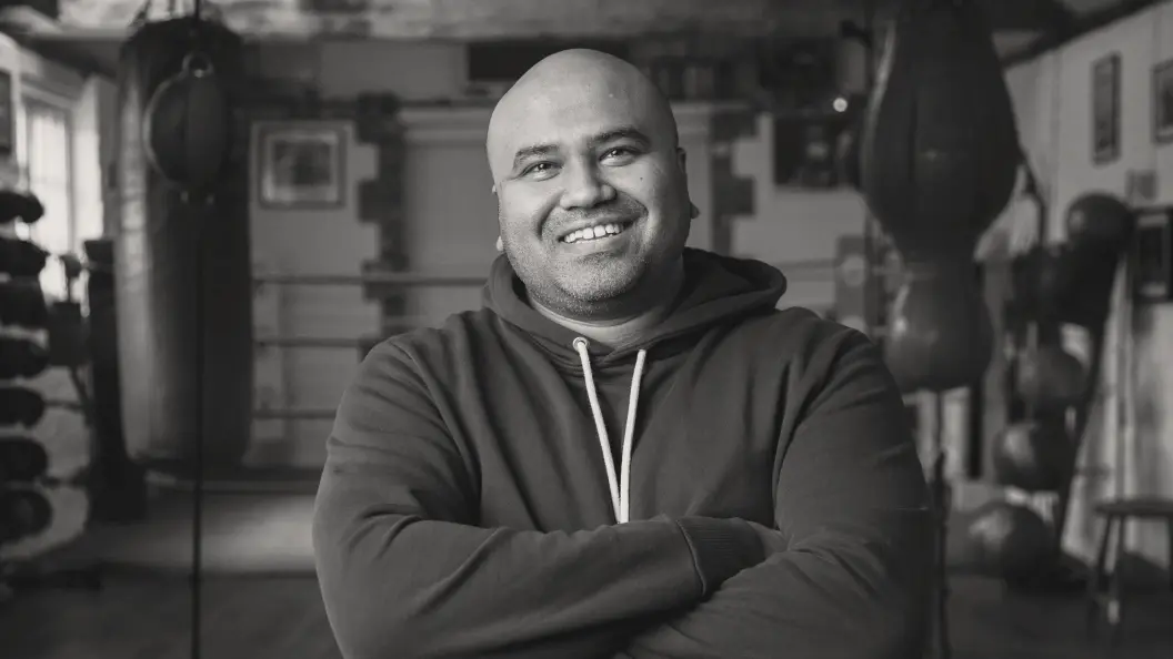 Headshot of a Black man in a gym 